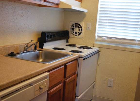 Stove and counter space at Whispering Oaks Apartments in Portsmouth VA