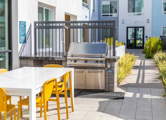 Poolside grilling area at Bevel Apartments in San Diego CA