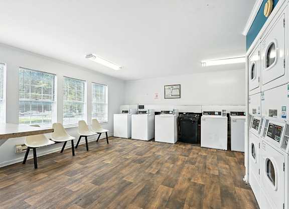 Laundry center with seating at Newport Apartment Homes in Nashville TN