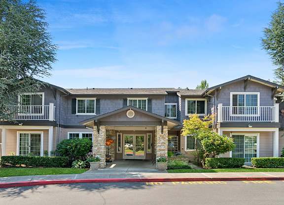 Leasing center exterior at Woodlands at Forbes Lake Apartments in Kirkland WA