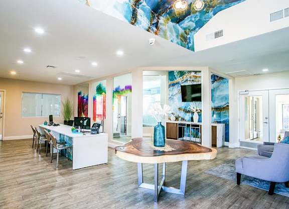 a gallery with many glass displays on the floor