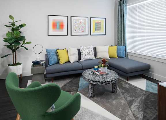 Living room seating at Jada Legacy Central Apartments in Plano TX