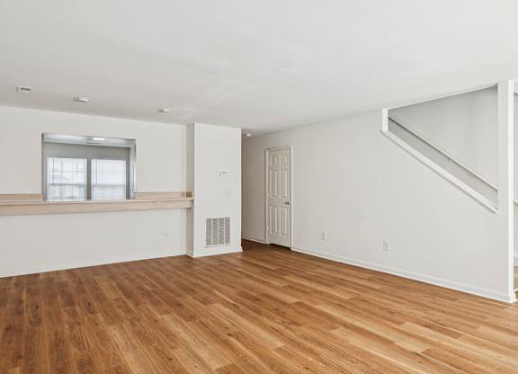 Living room with hardwood floor at Broadwater Townhomes in Chester VA