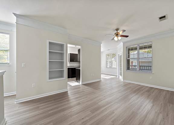 Living room with windows at Grand Oaks Apartments in Chester VA