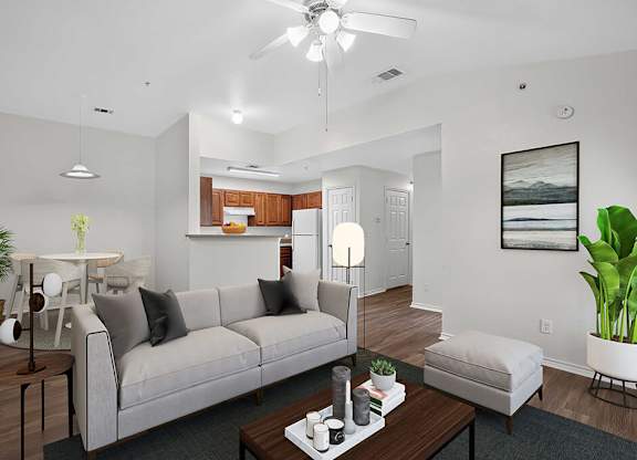 A living room with a grey couch and a coffee table.