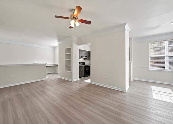 Living room with ceiling fan at Grand Oaks Apartments in Chester VA