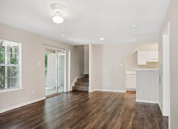 Living room with overhead lighting at Park Village Apartments in Conroe TX