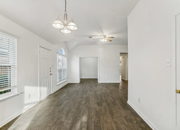 Living room with wood flooring at Sterling Green and Sheldon Ranch in Channelview TX