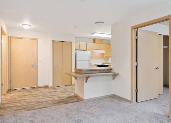 Living area and kitchen at Cedar Park Apartments in Seattle WA