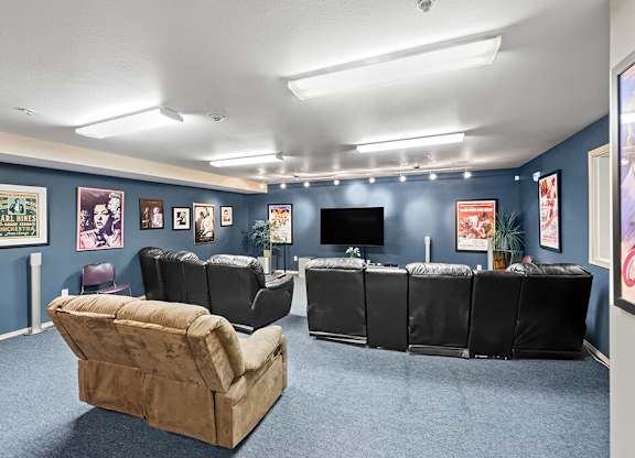 A room with a blue wall and a couch.
