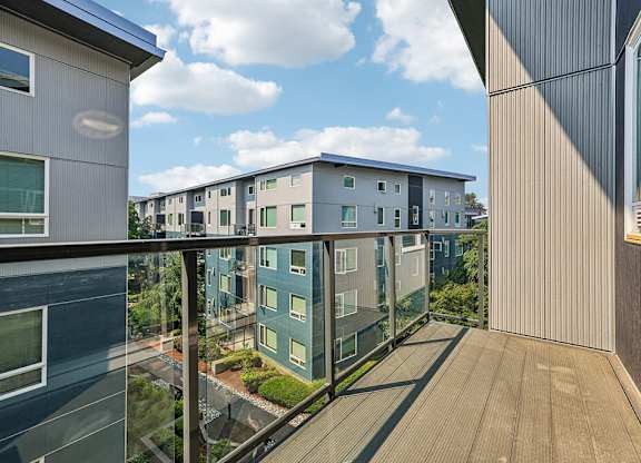 A balcony with a view of a residential area.