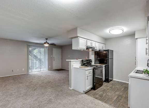 Black kitchen appliances at Mission James Place Apartments in Austin TX