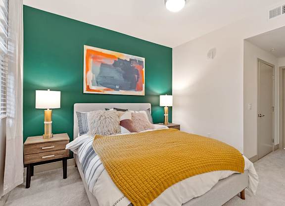 Bedroom with accent wall at Altitude Apartments in South San Francisco CA