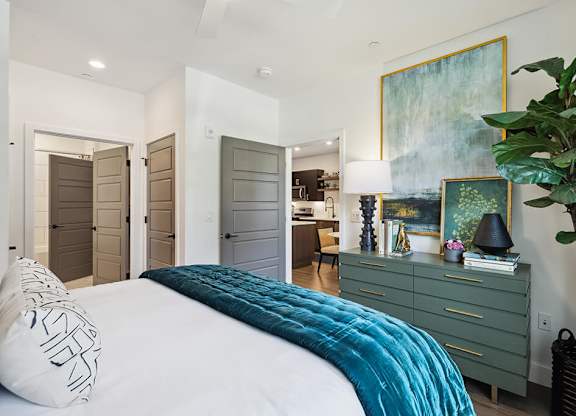 Model bedroom with furniture at Jayden Apartments in Peabody MA