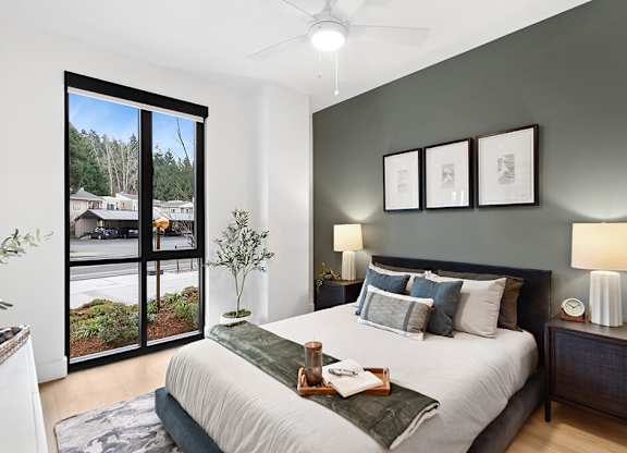 Bedroom with accent wall at The Brynn in Kirkland WA