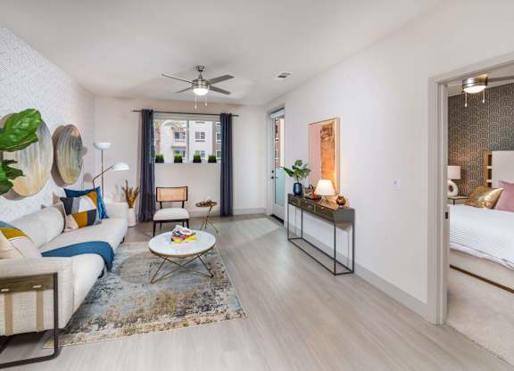 View of living room from kitchen at Avel Apartment Homes in Orange CA