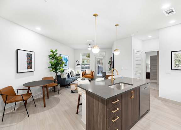 Model Concrete Design Package Kitchen Island at East Bend Apartments in Houston TX