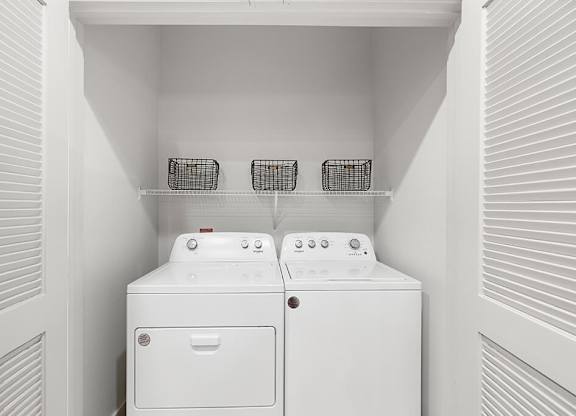 Model Concrete Design Package Washer and Dryer at East Bend Apartments in Houston TX