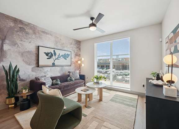 Living room with ceiling fan at Heights at 1520 Apartments in Houston TX