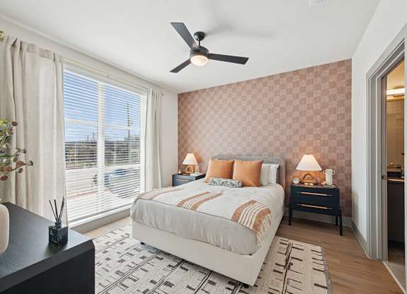 Bedroom with ceiling fan at Heights at 1520 Apartments in Houston TX