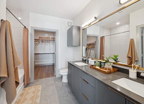 Bathroom with dual vanity at Heights at 1520 Apartments in Houston TX