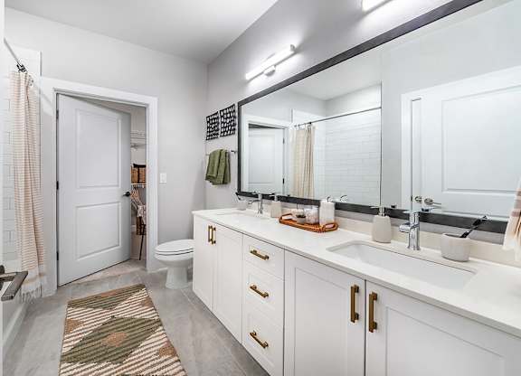 Model kale design primary bathroom at Cala Apartments in Austin TX