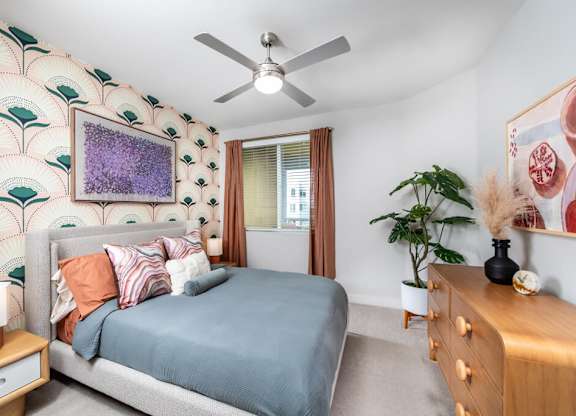 Bedroom with ceiling fan at Bevel Apartments in San Diego CA