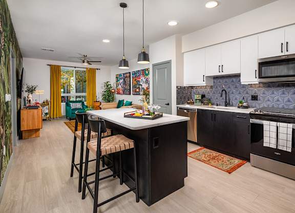 Model Pewter Kitchen and Living Room at Chroma Apartment Homes in Canoga Park CA