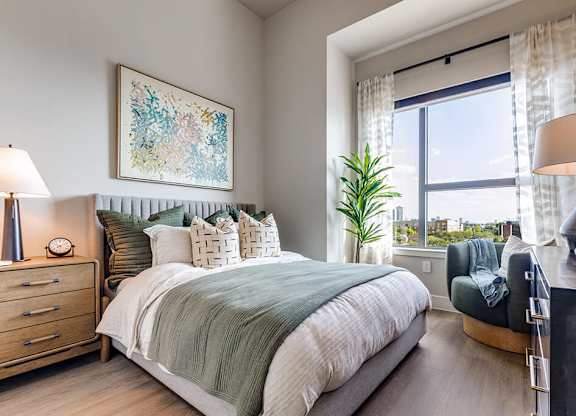 Sage design secondary bedroom at 1010 Waugh Apartments in Houston TX