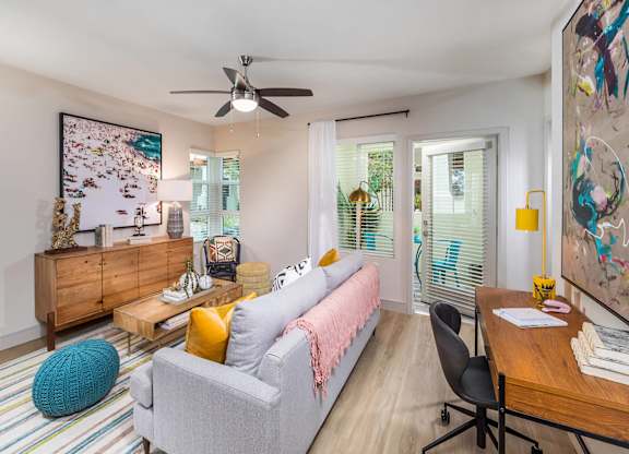 Sepia Design Package Living Room with ceiling fan at The Seaton Apartments in San Diego CA