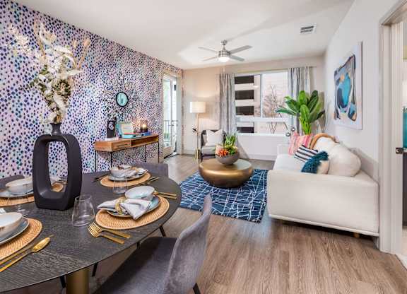 Living room with large window at Avel Apartment Homes in Orange CA