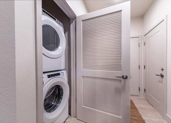 In unit stacked laundry at Olivean Apartments in Broomfield CO