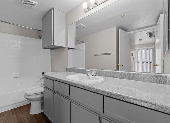 Modern bathroom with storage at Valley Ridge Apartments in Lewisville TX