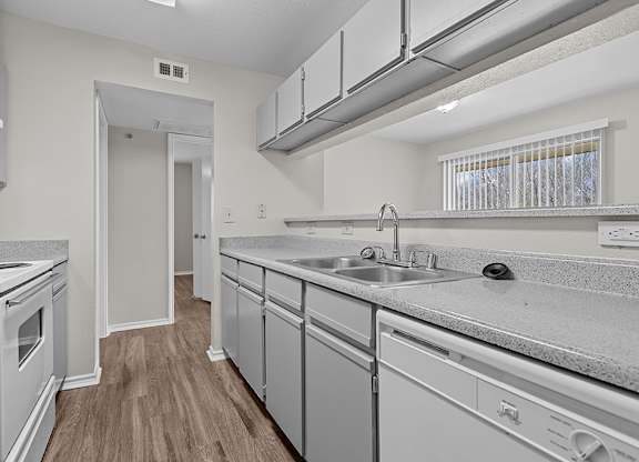 Modern kitchen with breakfast bar at Valley Ridge Apartments in Lewisville TX