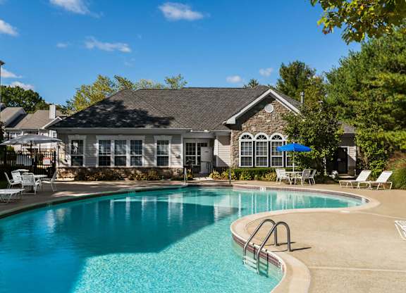 Pool with sun deck at River Pointe at Den Rock Apartments in Lawrence, MA