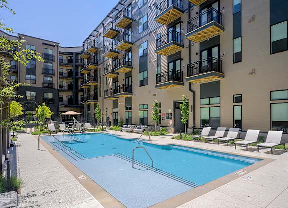 Pool with chairs at 333 Ellington Apartments in Gaithersburg MD