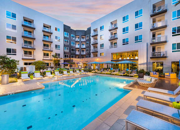 Swimming pool at dusk at Avel Apartment Homes in Orange CA