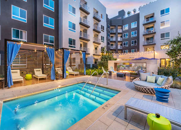 Swimming pool at dusk at Avel Apartment Homes in Orange CA