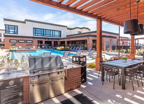 Pool courtyard grill area at Olivean Apartments in Broomfield CO