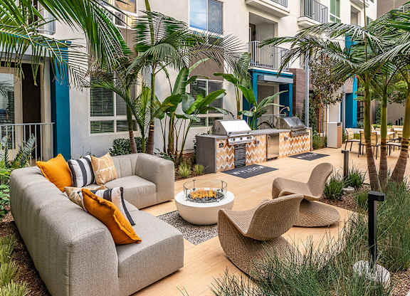 Pool grill and lounge at The Wylden Apartments in Los Angeles CA