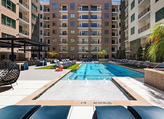 Pool Lounge Chairs at 1810 Main Apartments in Houston TX