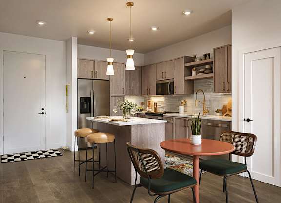 Kitchen in Brass Design package at Merrick on Midway Apartments in Farmers Branch TX