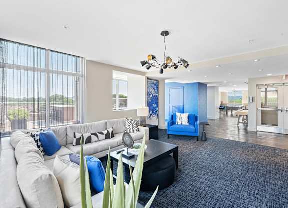 Resident clubhouse couches at Bradley Braddock Road Station Apartments in Alexandria VA