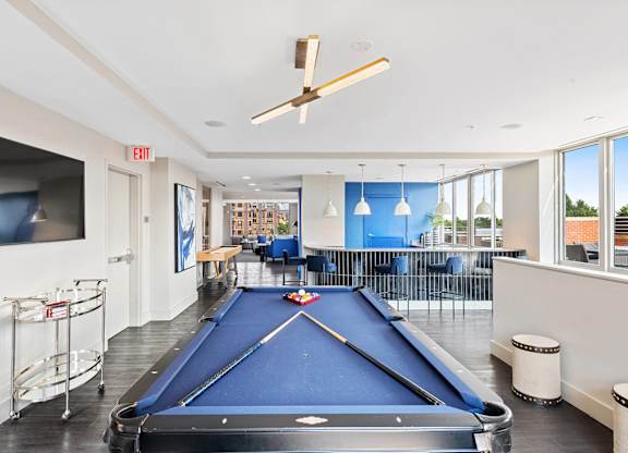 Resident clubhouse billiards table at Bradley Braddock Road Station Apartments in Alexandria VA