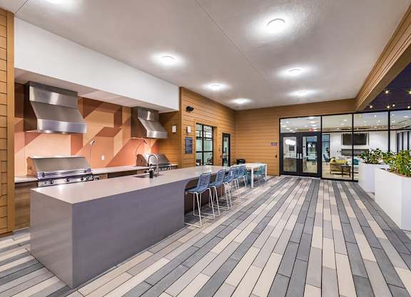 Rooftop Deck Grills at Dusk at Embark Apartments in Fremont CA