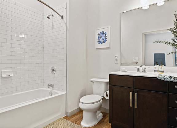 Bathroom with shower tub and toilet at The Slate at Andover Apartments in Andover MA