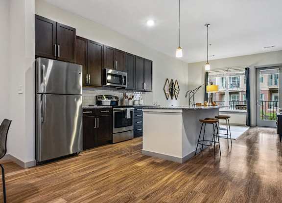 Kitchen with island seating at The Slate at Andover Apartments in Andover MA