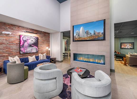 Social lounge fireplace at Luca Apartments in Austin TX
