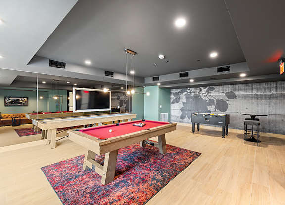 Social lounge gaming area at East Bend Apartments in Houston TX