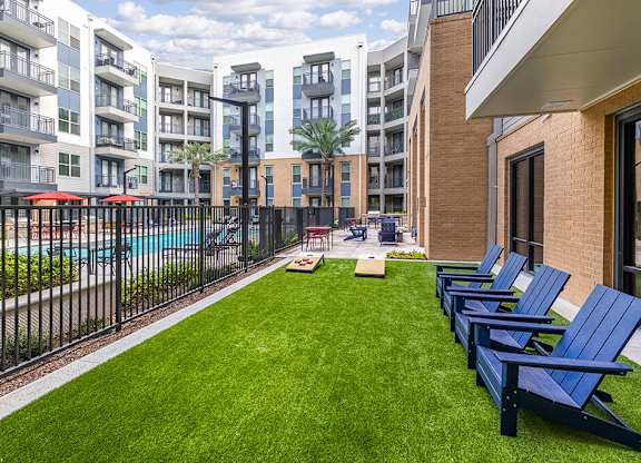 Social patio lounge chairs at Heights at 1520 Apartments in Houston TX